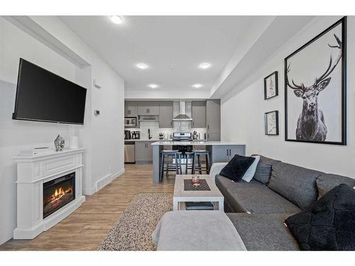 2104-100 Walgrove Court Se, Calgary, AB - Indoor Photo Showing Living Room With Fireplace