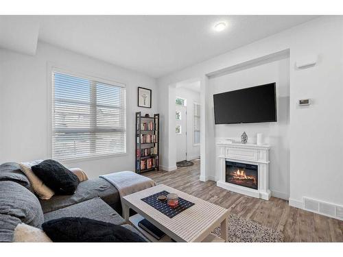 2104-100 Walgrove Court Se, Calgary, AB - Indoor Photo Showing Living Room With Fireplace