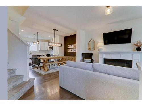 340 Kingsmere Way Se, Airdrie, AB - Indoor Photo Showing Living Room With Fireplace