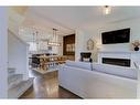 340 Kingsmere Way Se, Airdrie, AB  - Indoor Photo Showing Living Room With Fireplace 