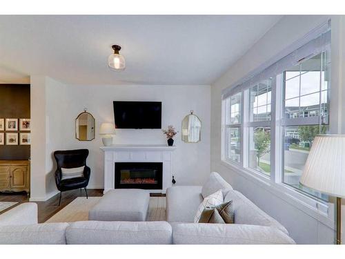 340 Kingsmere Way Se, Airdrie, AB - Indoor Photo Showing Living Room With Fireplace