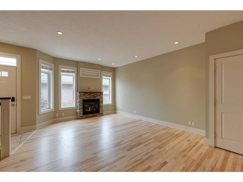 2-2231 28 Street Sw, Calgary, AB - Indoor Photo Showing Living Room With Fireplace