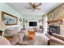 4719 69 Street Nw, Calgary, AB  - Indoor Photo Showing Living Room With Fireplace 