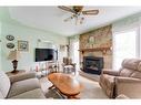 4719 69 Street Nw, Calgary, AB  - Indoor Photo Showing Living Room With Fireplace 