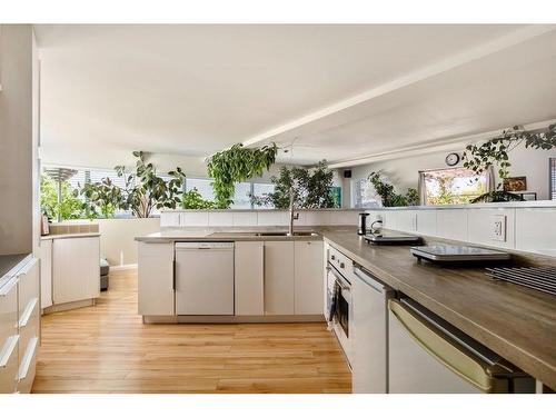 A & B-2109 20 Street, Nanton, AB - Indoor Photo Showing Kitchen With Double Sink