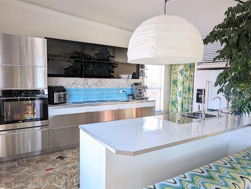 A & B-2109 20 Street, Nanton, AB - Indoor Photo Showing Kitchen With Double Sink