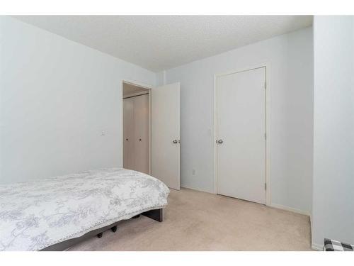 20 Erin Woods Court Se, Calgary, AB - Indoor Photo Showing Bedroom