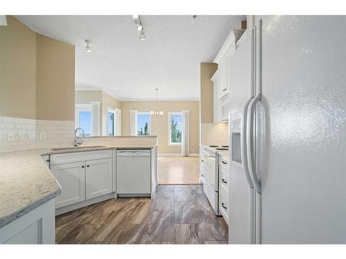 308-200 Patina Court Sw, Calgary, AB - Indoor Photo Showing Kitchen With Upgraded Kitchen