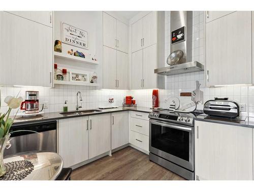 103-12 Mahogany Path Se, Calgary, AB - Indoor Photo Showing Kitchen With Double Sink