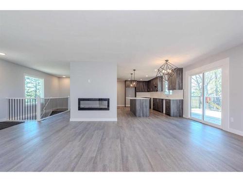 261025 Mountain View Road Nw, Calgary, AB - Indoor Photo Showing Living Room With Fireplace