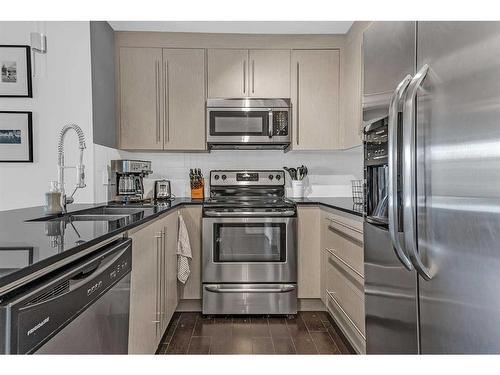 2417-11 Mahogany Row Se, Calgary, AB - Indoor Photo Showing Kitchen With Stainless Steel Kitchen With Double Sink With Upgraded Kitchen