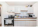 1501 39 Street Se, Calgary, AB  - Indoor Photo Showing Kitchen With Double Sink 