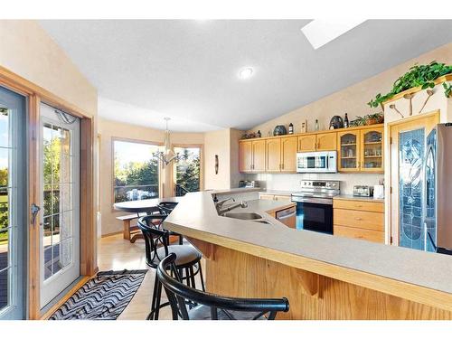 20-31222 Range Road 20A, Rural Mountain View County, AB - Indoor Photo Showing Kitchen With Double Sink