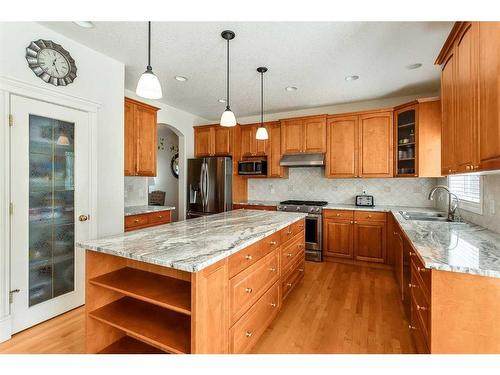 11 Evercreek Bluffs Road Sw, Calgary, AB - Indoor Photo Showing Kitchen With Stainless Steel Kitchen With Double Sink With Upgraded Kitchen