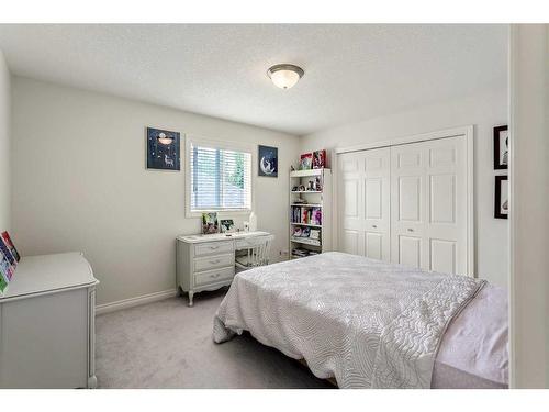 11 Evercreek Bluffs Road Sw, Calgary, AB - Indoor Photo Showing Bedroom