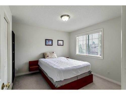 11 Evercreek Bluffs Road Sw, Calgary, AB - Indoor Photo Showing Bedroom