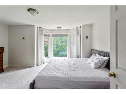 11 Evercreek Bluffs Road Sw, Calgary, AB - Indoor Photo Showing Bedroom