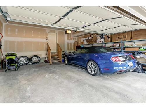 11 Evercreek Bluffs Road Sw, Calgary, AB - Indoor Photo Showing Garage