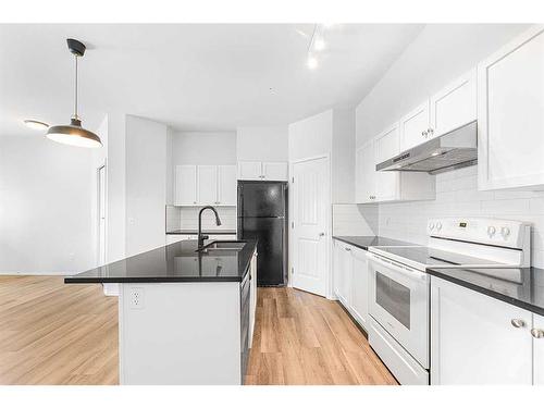 104-141 Panatella Street Nw, Calgary, AB - Indoor Photo Showing Kitchen