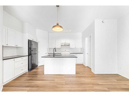 104-141 Panatella Street Nw, Calgary, AB - Indoor Photo Showing Kitchen