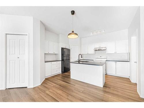 104-141 Panatella Street Nw, Calgary, AB - Indoor Photo Showing Kitchen