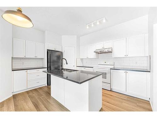 104-141 Panatella Landing Nw, Calgary, AB - Indoor Photo Showing Kitchen