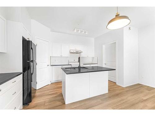 104-141 Panatella Street Nw, Calgary, AB - Indoor Photo Showing Kitchen