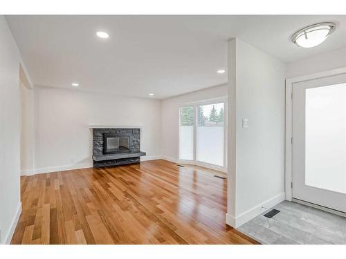 2015 Palisprior Road Sw, Calgary, AB - Indoor Photo Showing Other Room With Fireplace