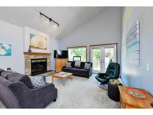 244 Sierra Morena Place Sw, Calgary, AB - Indoor Photo Showing Living Room With Fireplace