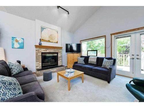 244 Sierra Morena Place Sw, Calgary, AB - Indoor Photo Showing Living Room With Fireplace