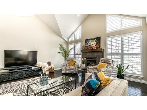 904 Patterson View Sw, Calgary, AB - Indoor Photo Showing Living Room With Fireplace