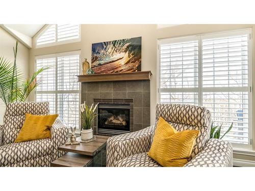 904 Patterson View Sw, Calgary, AB - Indoor Photo Showing Living Room With Fireplace