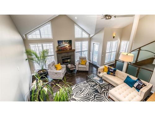 904 Patterson View Sw, Calgary, AB - Indoor Photo Showing Living Room With Fireplace