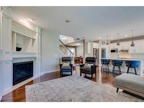 133 Kincora Place Nw, Calgary, AB - Indoor Photo Showing Living Room With Fireplace