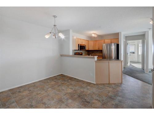 2207-950 Arbour Lake Road Nw, Calgary, AB - Indoor Photo Showing Kitchen