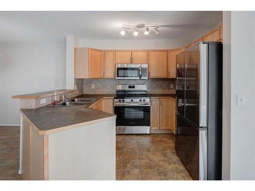 2207-950 Arbour Lake Road Nw, Calgary, AB - Indoor Photo Showing Kitchen With Double Sink