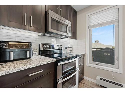 315-10 Mahogany Mews Se, Calgary, AB - Indoor Photo Showing Kitchen With Stainless Steel Kitchen With Upgraded Kitchen