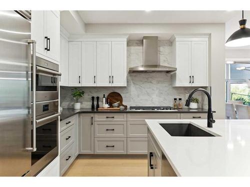 110-15 Cougar Ridge Landing Sw, Calgary, AB - Indoor Photo Showing Kitchen With Upgraded Kitchen