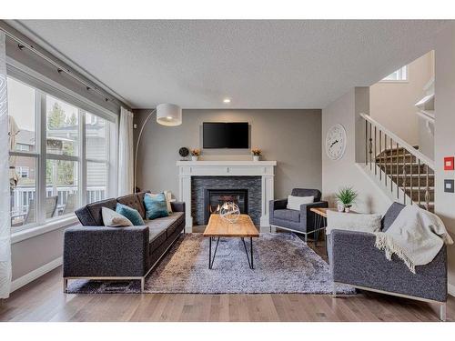 70 Auburn Springs Close Se, Calgary, AB - Indoor Photo Showing Living Room With Fireplace