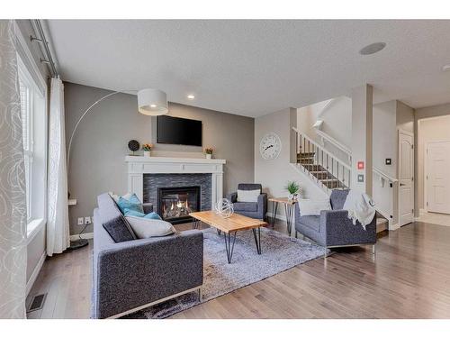 70 Auburn Springs Close Se, Calgary, AB - Indoor Photo Showing Living Room With Fireplace