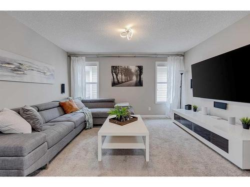 70 Auburn Springs Close Se, Calgary, AB - Indoor Photo Showing Living Room