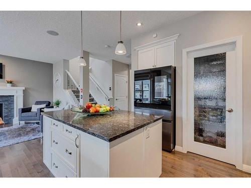 70 Auburn Springs Close Se, Calgary, AB - Indoor Photo Showing Kitchen With Fireplace