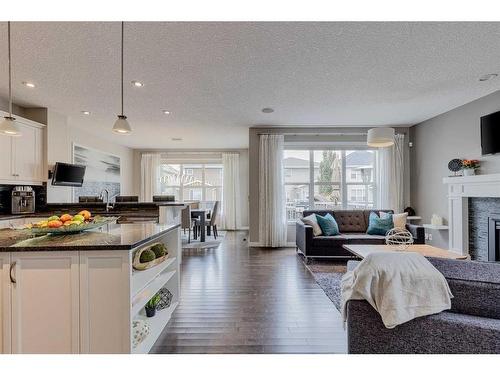 70 Auburn Springs Close Se, Calgary, AB - Indoor Photo Showing Other Room With Fireplace