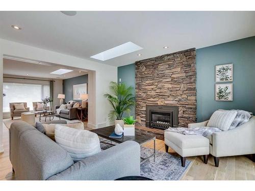 12222 Lake Erie Road Se, Calgary, AB - Indoor Photo Showing Living Room With Fireplace