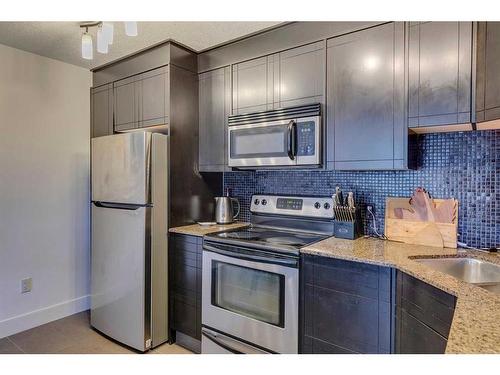 408-812 14 Avenue Sw, Calgary, AB - Indoor Photo Showing Kitchen With Stainless Steel Kitchen