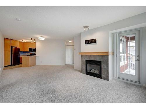 428-22 Richard Place Sw, Calgary, AB - Indoor Photo Showing Living Room With Fireplace