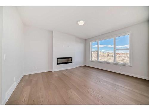 44 Carringvue Passage Nw, Calgary, AB - Indoor Photo Showing Other Room With Fireplace