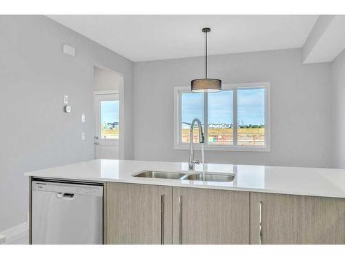 608 Dawson Drive, Chestermere, AB - Indoor Photo Showing Kitchen With Double Sink