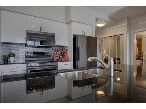 1804-8710 Horton Road Sw, Calgary, AB - Indoor Photo Showing Kitchen With Double Sink