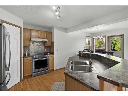 426 Tuscany Ridge Heights Nw, Calgary, AB - Indoor Photo Showing Kitchen With Stainless Steel Kitchen With Double Sink